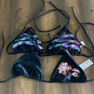 Two black swim tops.